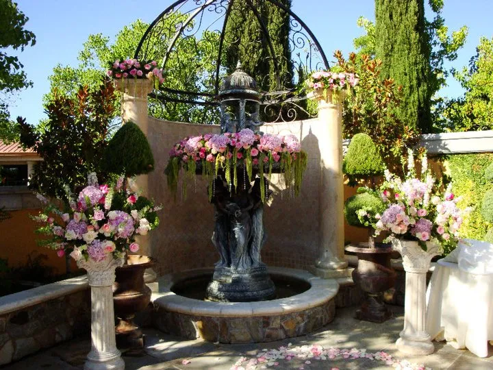 Futuristic roller coaster inside a vibrant, neon-lit indoor amusement park.