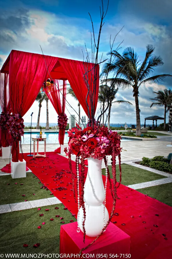Futuristic roller coaster inside a vibrant, neon-lit indoor amusement park.