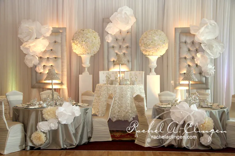 Futuristic roller coaster inside a vibrant, neon-lit indoor amusement park.