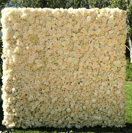 Futuristic roller coaster inside a vibrant, neon-lit indoor amusement park.