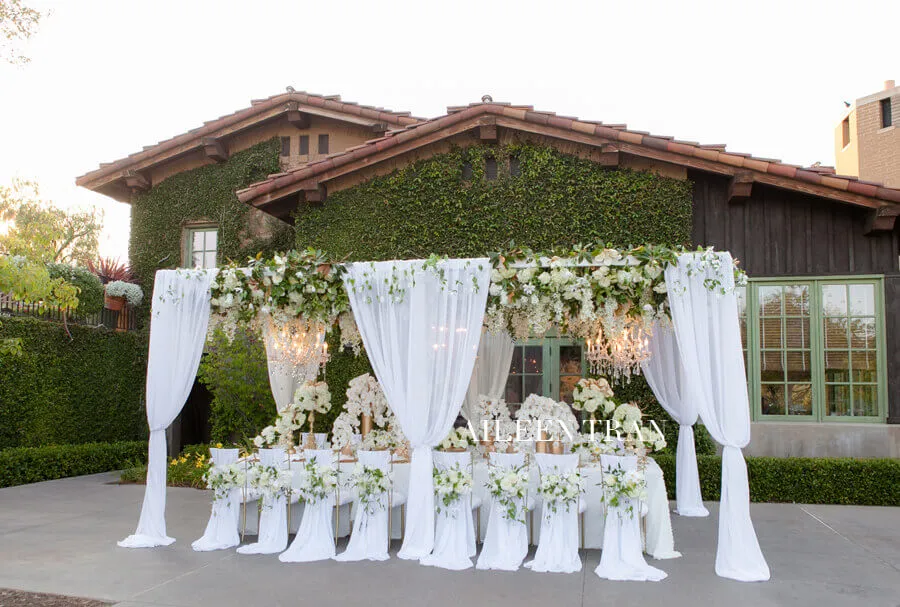 Futuristic roller coaster inside a vibrant, neon-lit indoor amusement park.