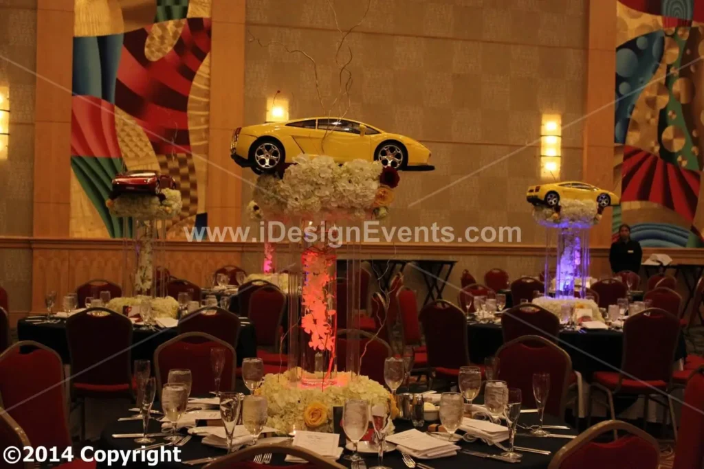 Futuristic roller coaster inside a vibrant, neon-lit indoor amusement park.