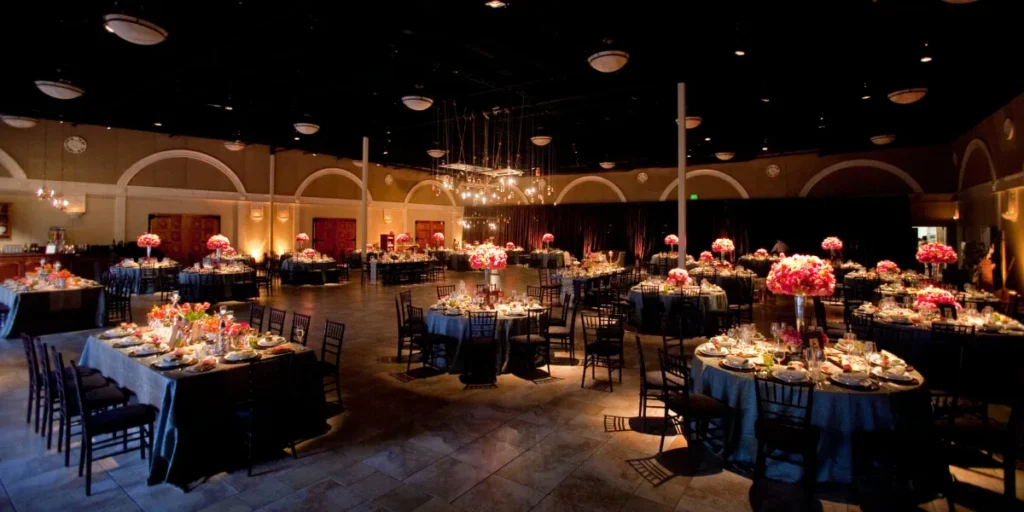Elegant banquet hall with round tables set for a formal event.