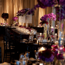 Elegant wedding ceremony setup with chandeliers and floral arrangements.