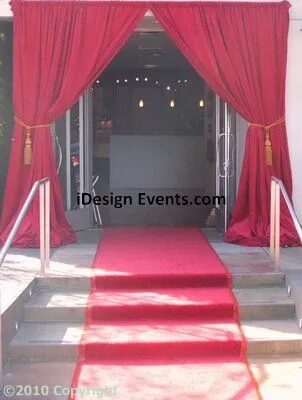 Futuristic roller coaster inside a vibrant, neon-lit indoor amusement park.