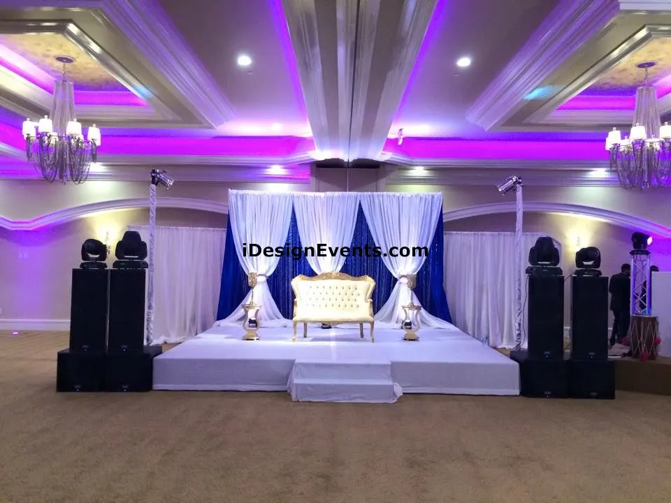 Futuristic roller coaster inside a vibrant, neon-lit indoor amusement park.