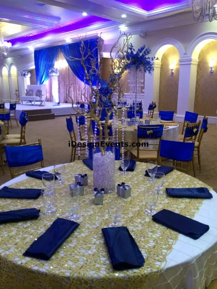 Futuristic roller coaster inside a vibrant, neon-lit indoor amusement park.