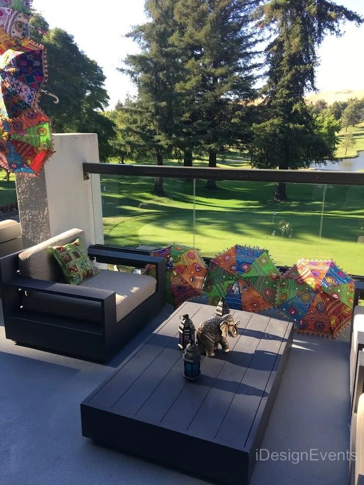 Futuristic roller coaster inside a vibrant, neon-lit indoor amusement park.
