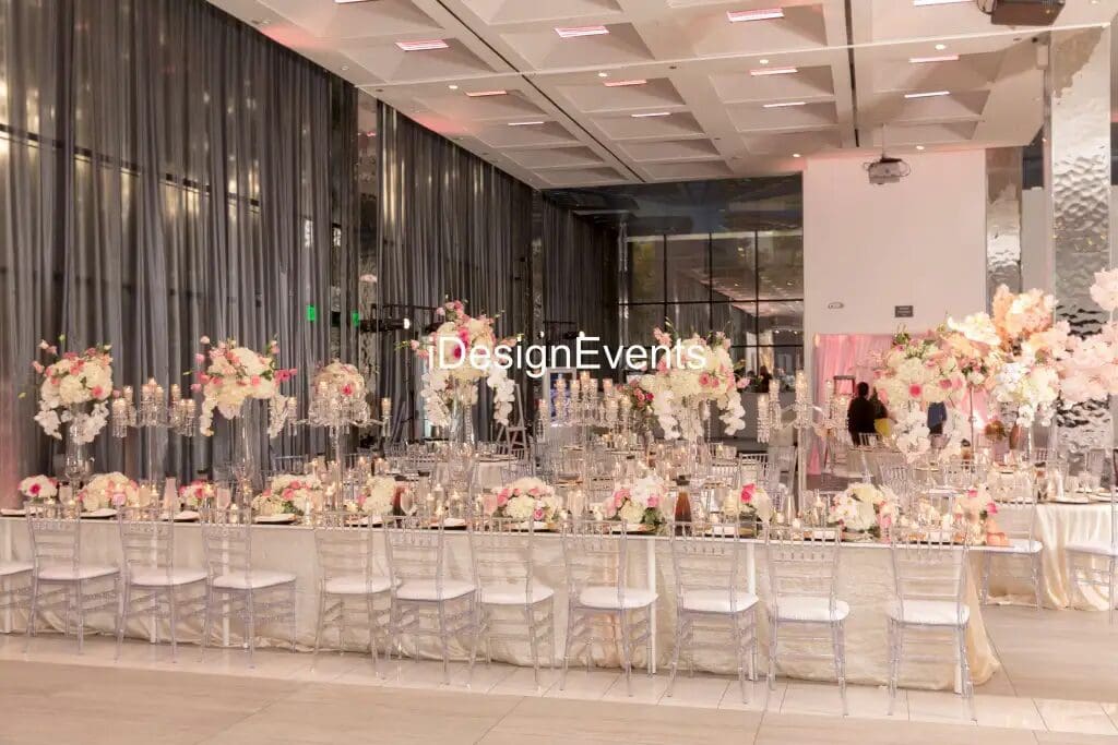 Elegant wedding reception setup with floral centerpieces and soft lighting.