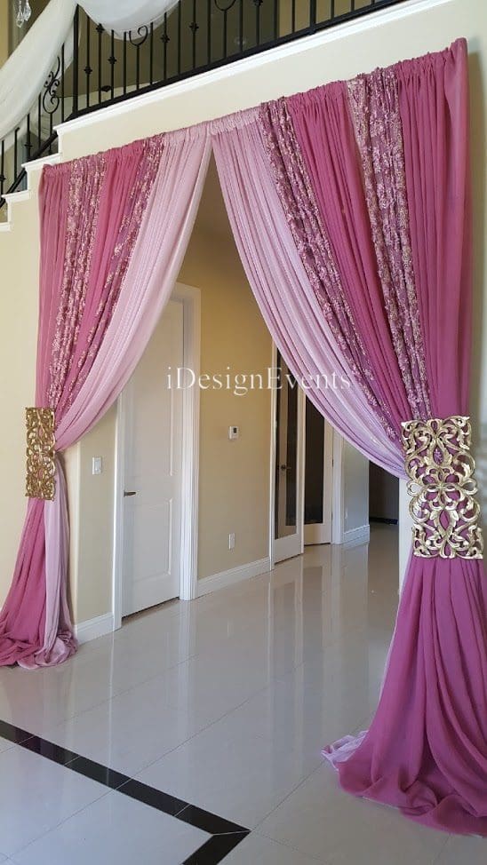 Futuristic roller coaster inside a vibrant, neon-lit indoor amusement park.