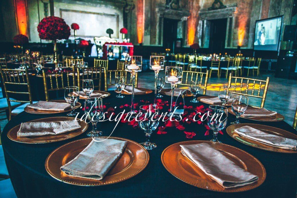 Futuristic roller coaster inside a vibrant, neon-lit indoor amusement park.