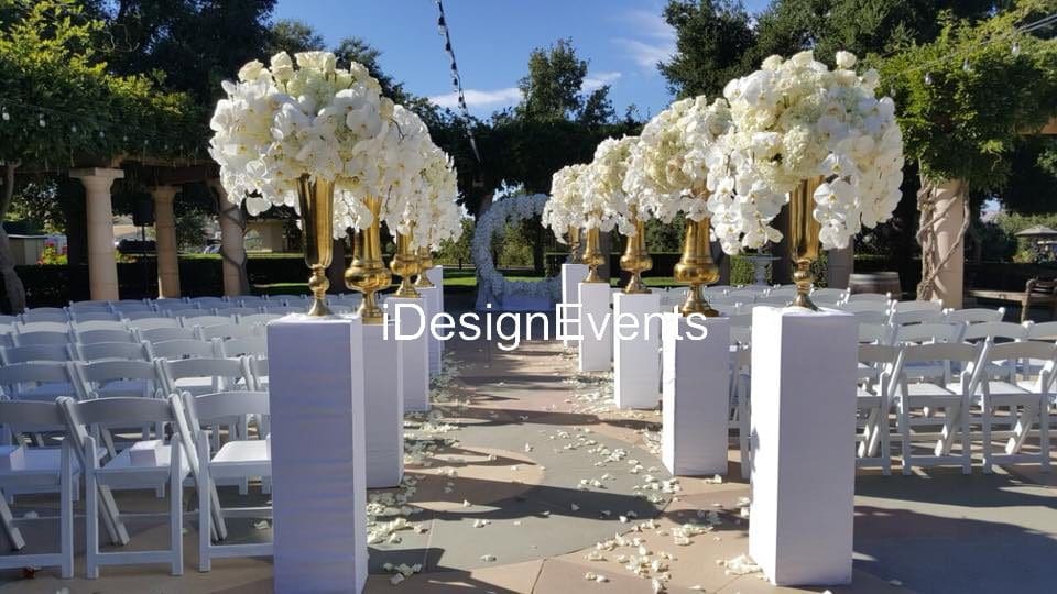 Futuristic roller coaster inside a vibrant, neon-lit indoor amusement park.