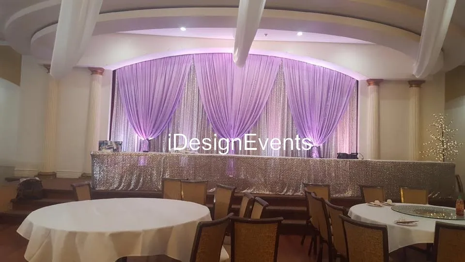 Futuristic roller coaster inside a vibrant, neon-lit indoor amusement park.