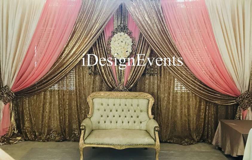 Futuristic roller coaster inside a vibrant, neon-lit indoor amusement park.