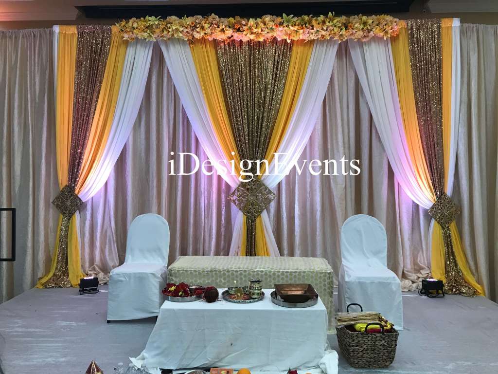 Futuristic roller coaster inside a vibrant, neon-lit indoor amusement park.