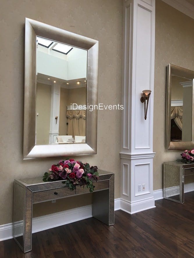 Futuristic roller coaster inside a vibrant, neon-lit indoor amusement park.