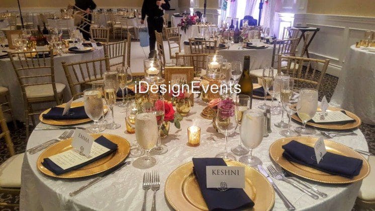Futuristic roller coaster inside a vibrant, neon-lit indoor amusement park.