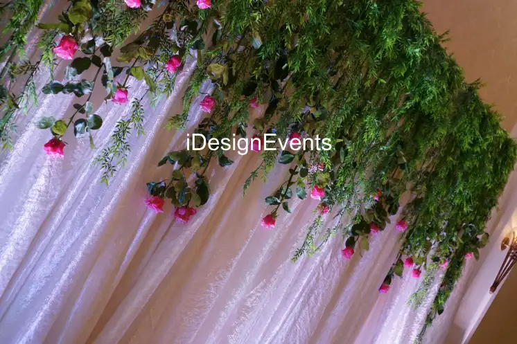Futuristic roller coaster inside a vibrant, neon-lit indoor amusement park.