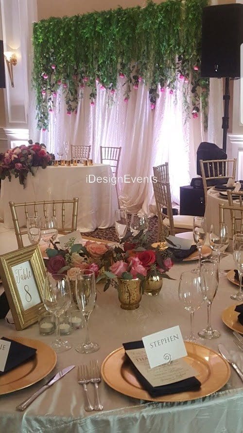 Futuristic roller coaster inside a vibrant, neon-lit indoor amusement park.