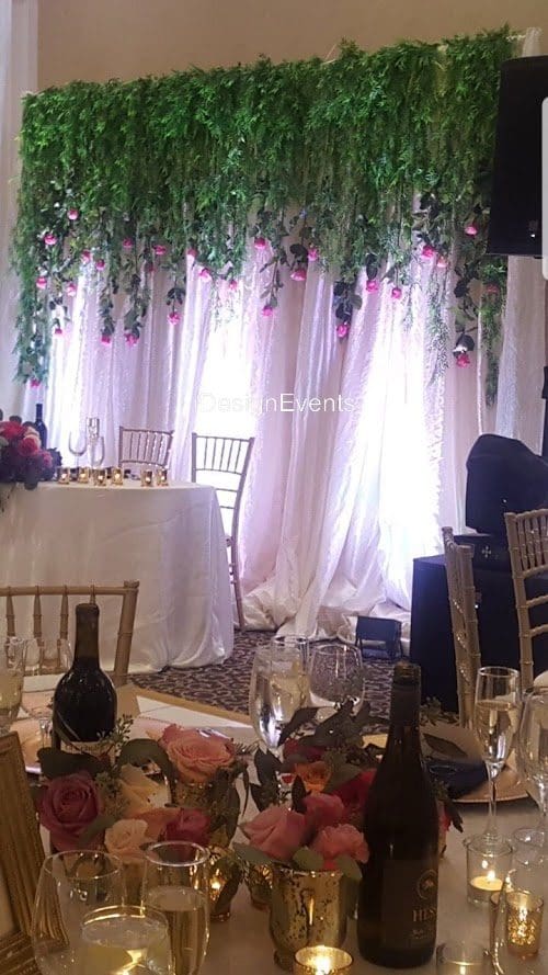 Futuristic roller coaster inside a vibrant, neon-lit indoor amusement park.