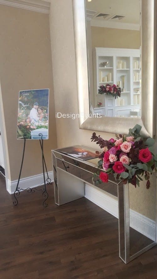 Futuristic roller coaster inside a vibrant, neon-lit indoor amusement park.