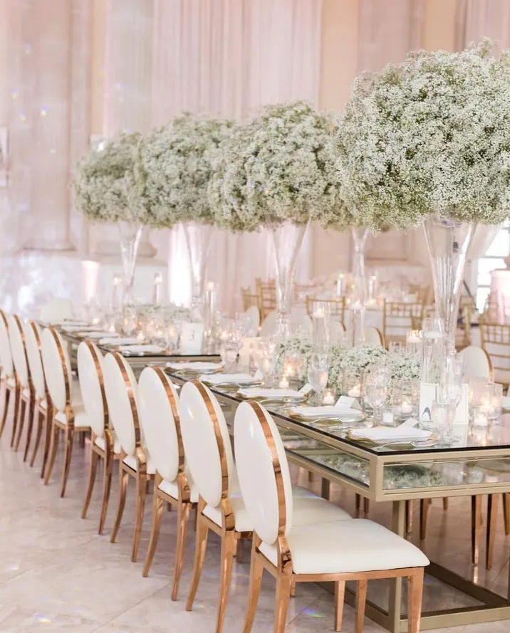 Futuristic roller coaster inside a vibrant, neon-lit indoor amusement park.