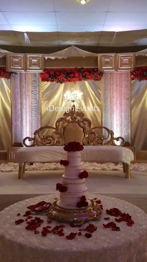 Futuristic roller coaster inside a vibrant, neon-lit indoor amusement park.