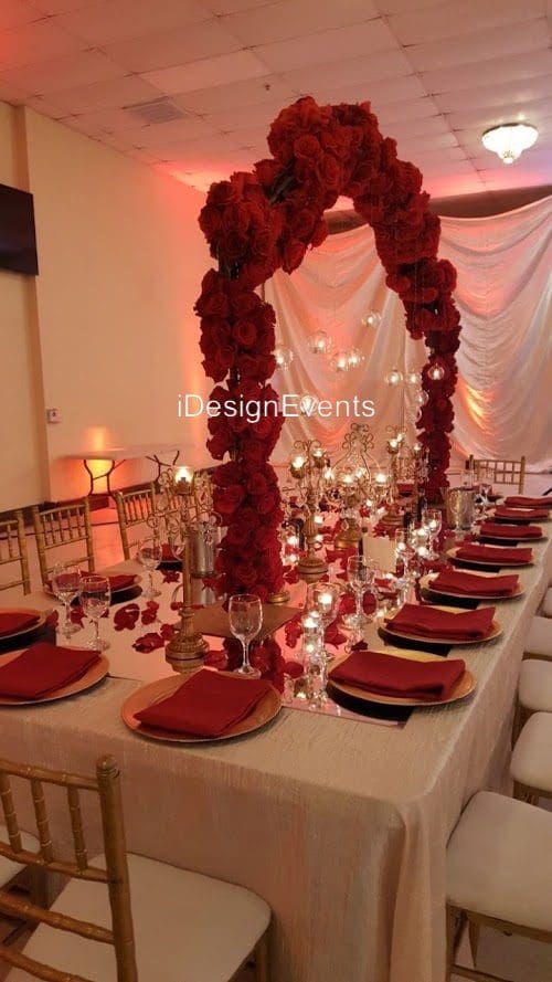 Futuristic roller coaster inside a vibrant, neon-lit indoor amusement park.
