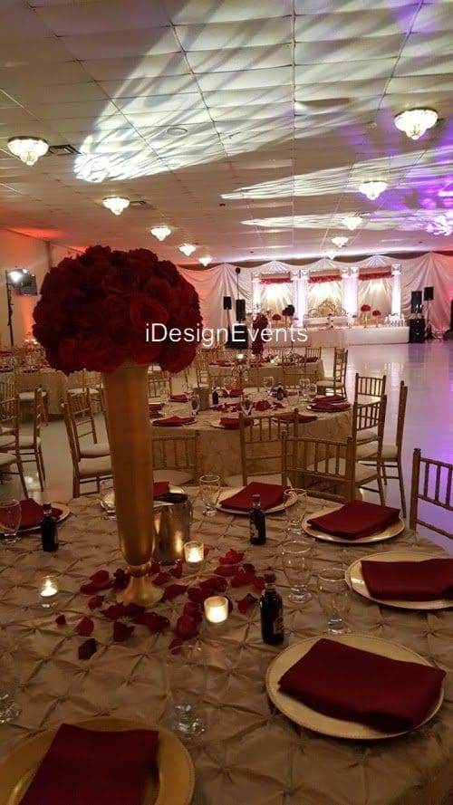 Futuristic roller coaster inside a vibrant, neon-lit indoor amusement park.