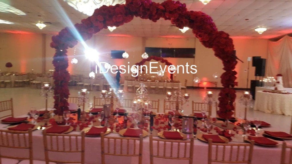 Futuristic roller coaster inside a vibrant, neon-lit indoor amusement park.