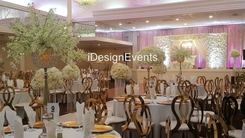 Futuristic roller coaster inside a vibrant, neon-lit indoor amusement park.