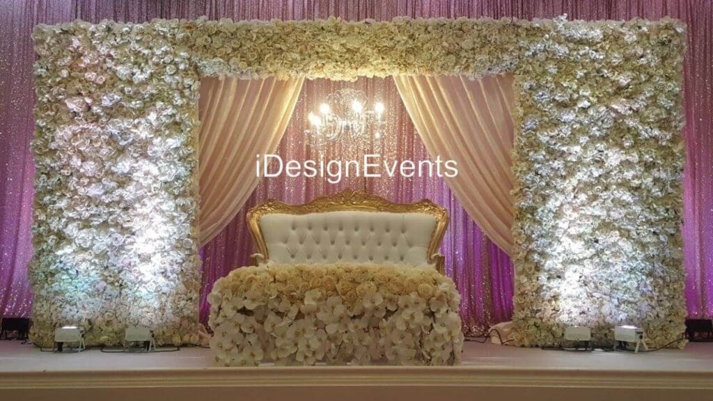 Futuristic roller coaster inside a vibrant, neon-lit indoor amusement park.