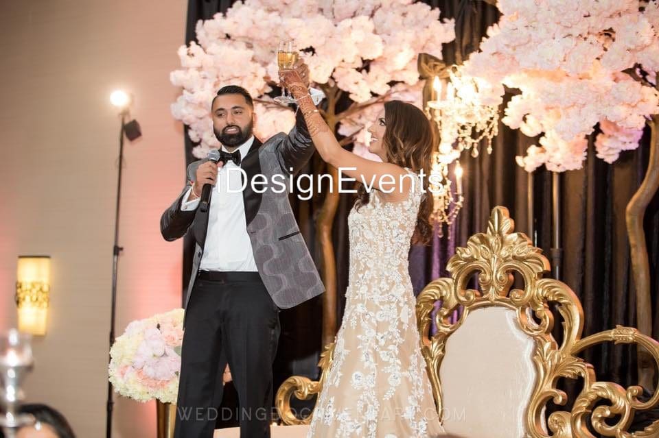 Futuristic roller coaster inside a vibrant, neon-lit indoor amusement park.