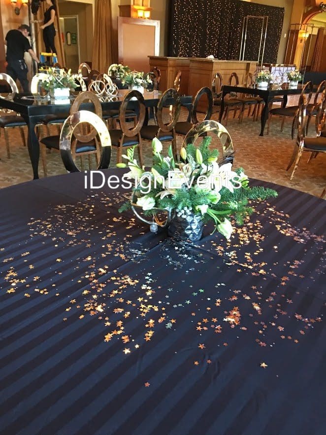 Futuristic roller coaster inside a vibrant, neon-lit indoor amusement park.