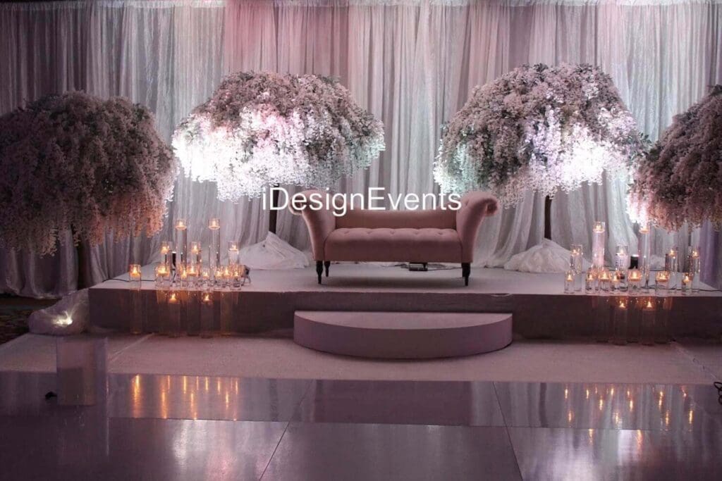 Futuristic roller coaster inside a vibrant, neon-lit indoor amusement park.