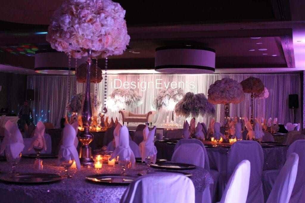 Futuristic roller coaster inside a vibrant, neon-lit indoor amusement park.