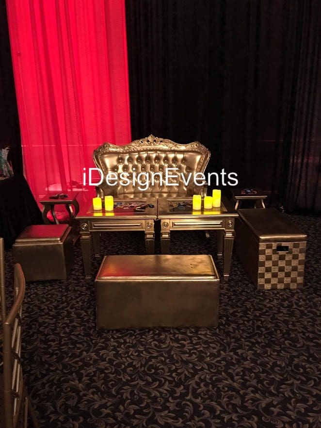 Luxurious chess-themed event setup with elegant lighting and decor.