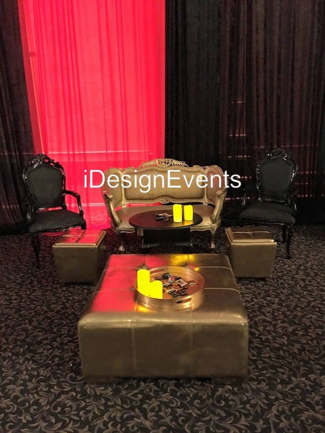 Elegant event seating with vintage chairs and ambient lighting.