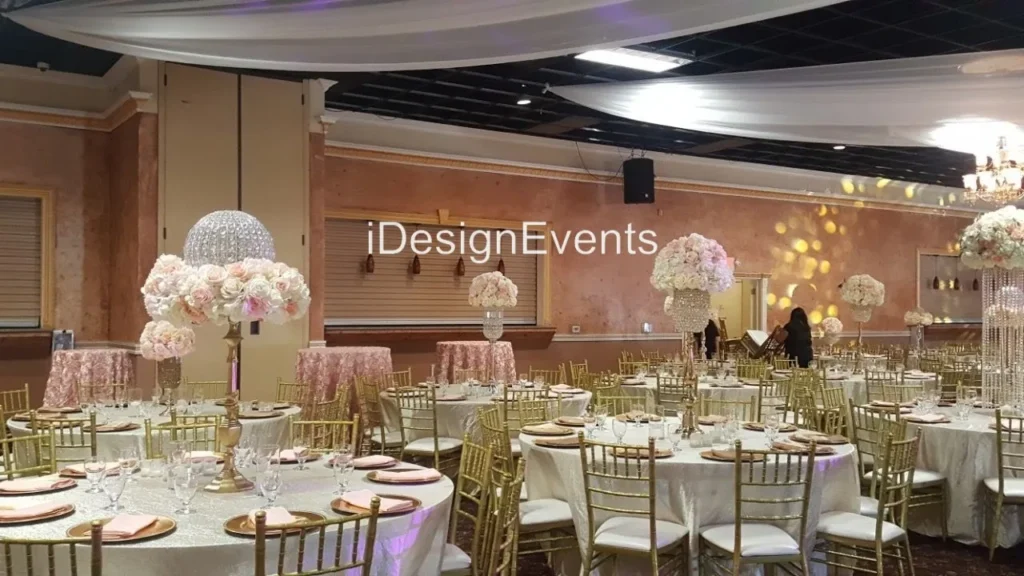 Elegant glass candle holders with lit candles reflecting on a glossy surface.