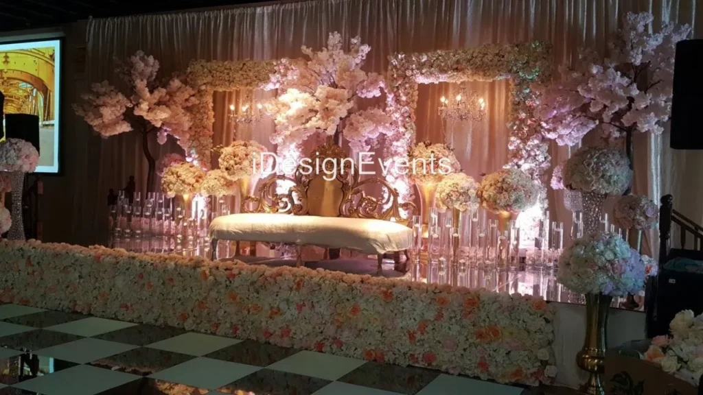 Elegant glass candle holders with lit candles reflecting on a glossy surface.