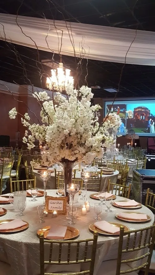 Elegant floral centerpiece at a formal event table.