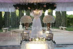 Elegant wedding reception setup with floral decorations and ambient lighting.