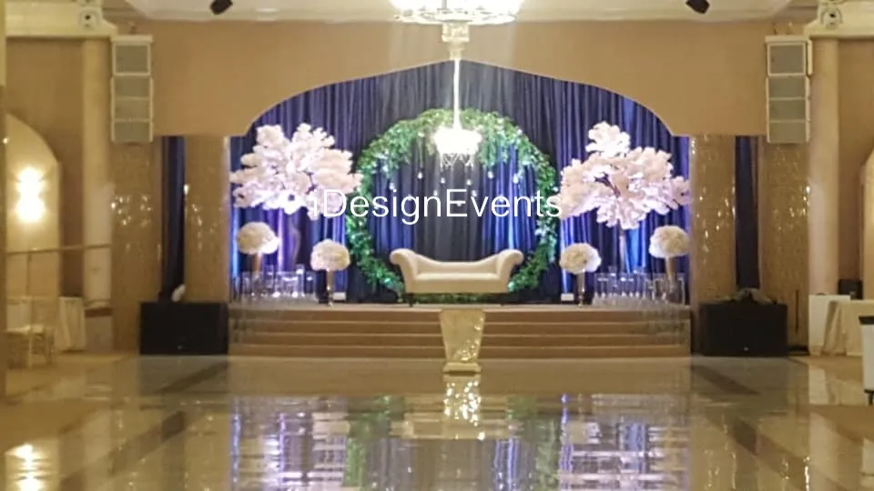 Elegant wedding reception setup with floral centerpieces and candlelight.