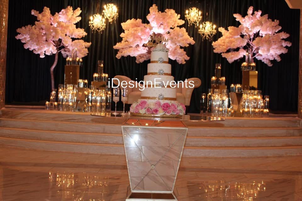 Elegant wedding reception setup with floral centerpieces and candlelight.