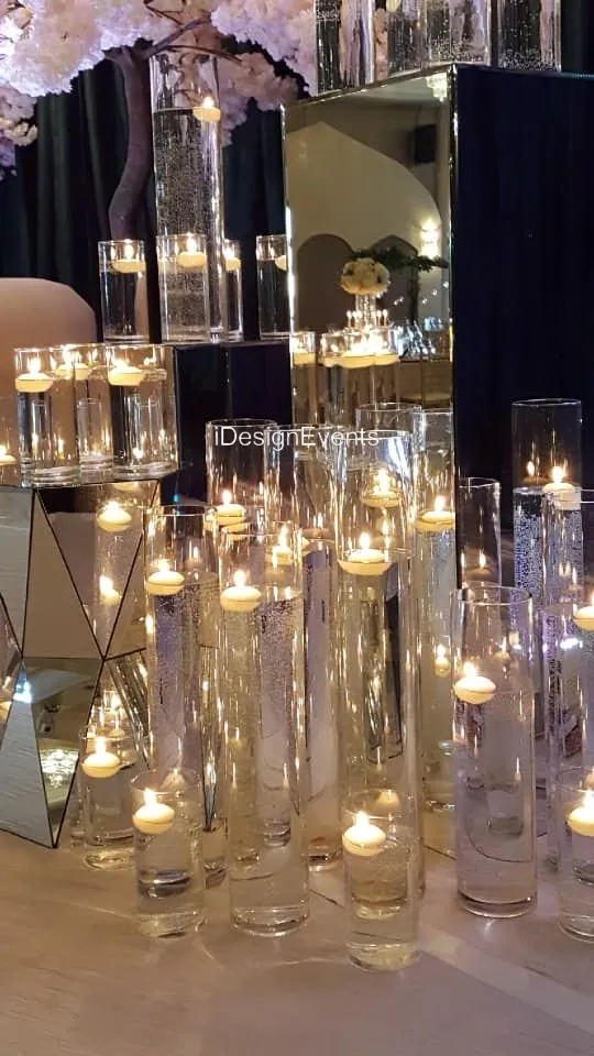 Elegant glass candle holders with lit candles creating a warm ambiance.
