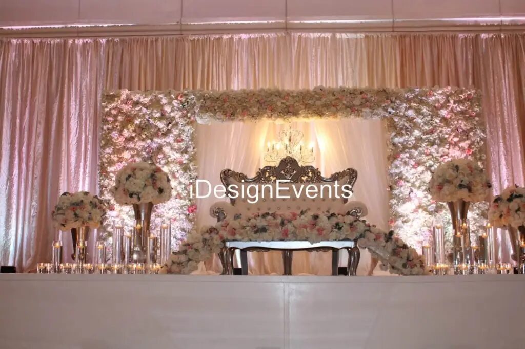 Futuristic roller coaster inside a vibrant, neon-lit indoor amusement park.