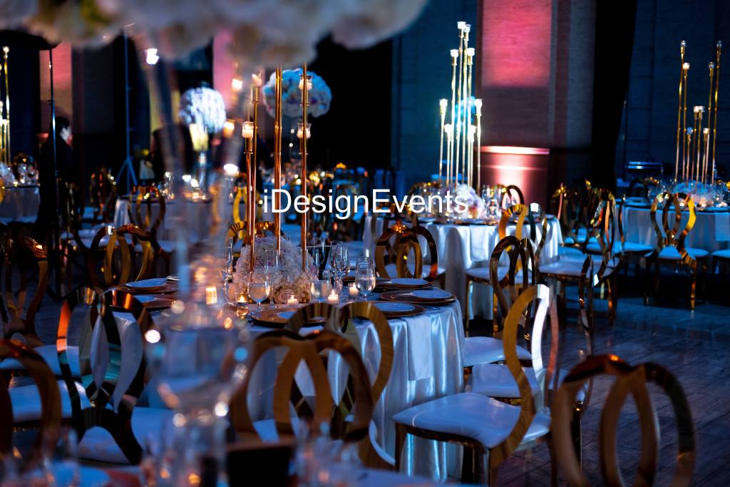 Elegant event hall with crystal chandeliers and stylish seating.