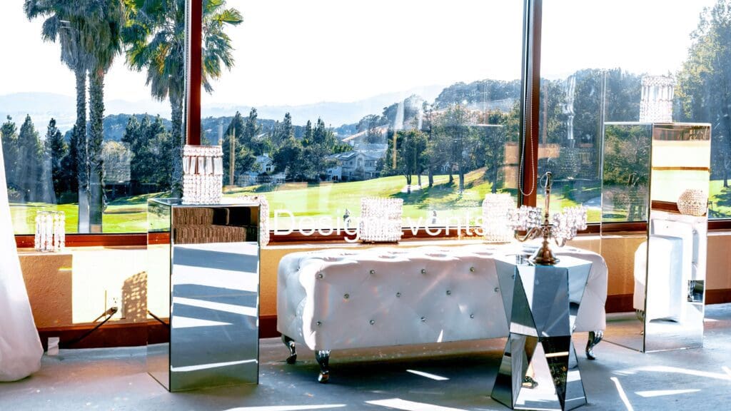 Futuristic roller coaster inside a vibrant, neon-lit indoor amusement park.