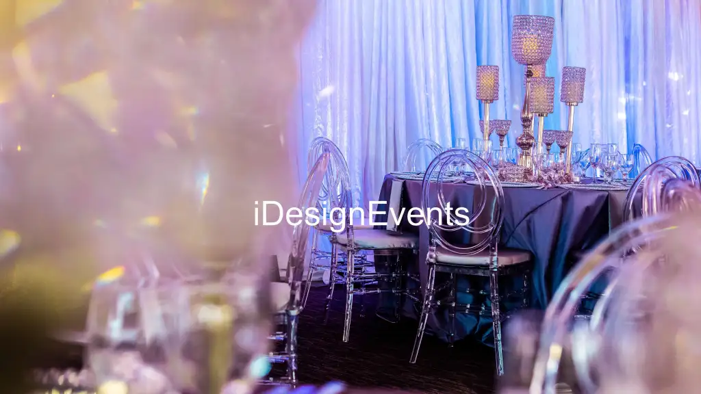 Elegant event setup with luxurious chairs and soft lighting.