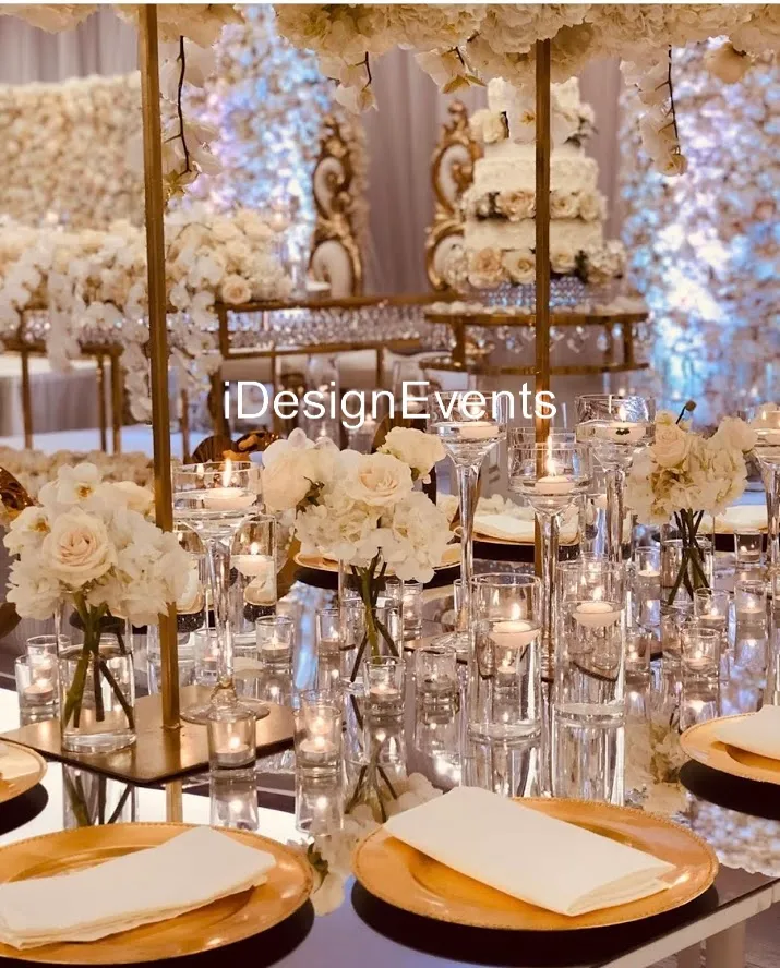 Elegant wedding table setup with white flowers and candles.